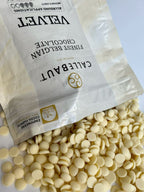 Callebaut white chocolate chips with a visible packaging label on a light background
