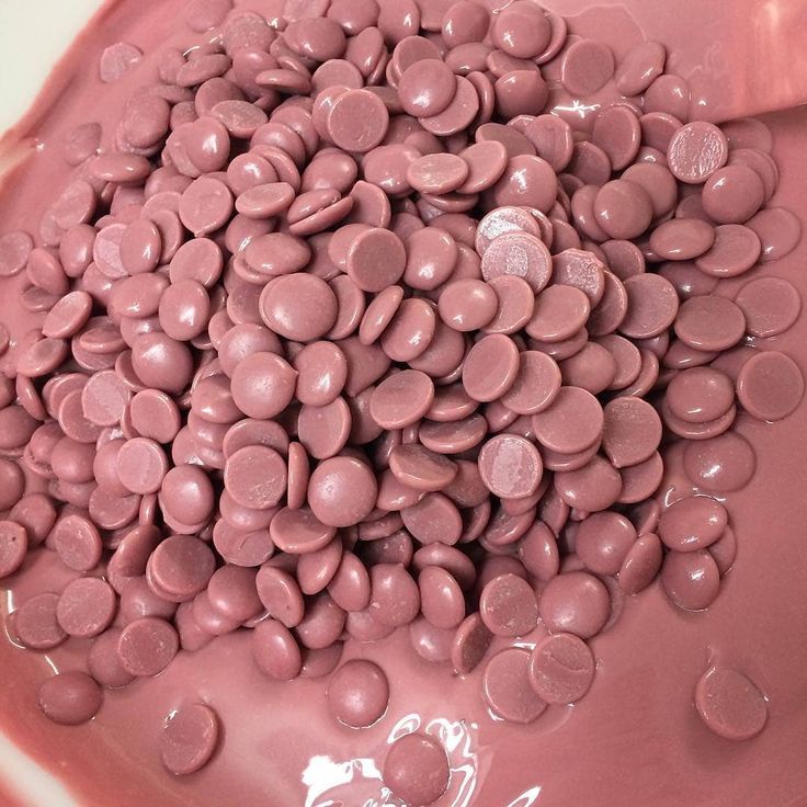 Close-up of pink chocolate chips on a pink background, RubyRB2 callebaut callets